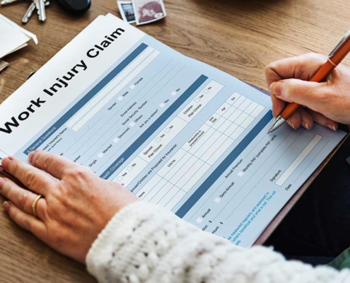 What is the first step that should be taken after suffering an injury at work?