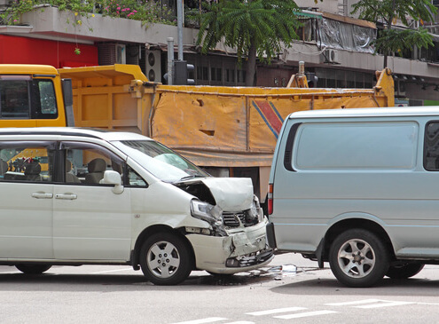 What happens if an individual is involved in a car accident while on the job?