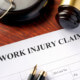 What type of legal recourse can a person take after suffering an injury at work?